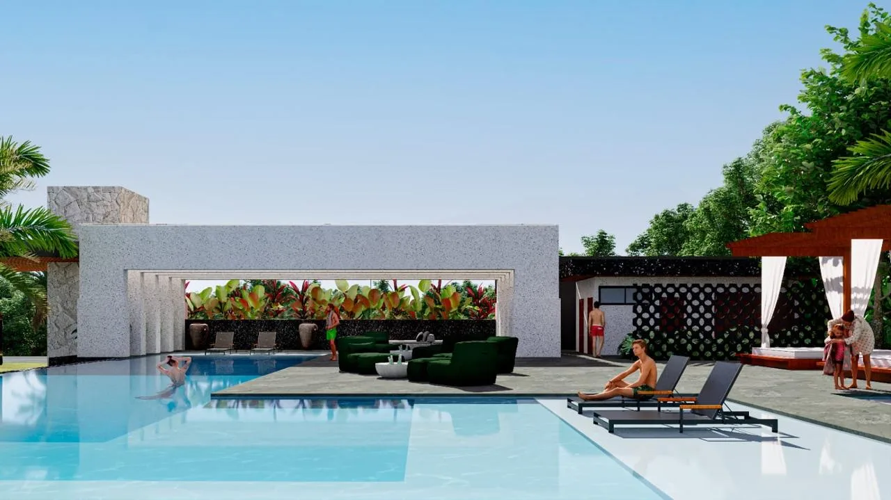 Piscinas do L'Harmonie Club iluminadas ao entardecer